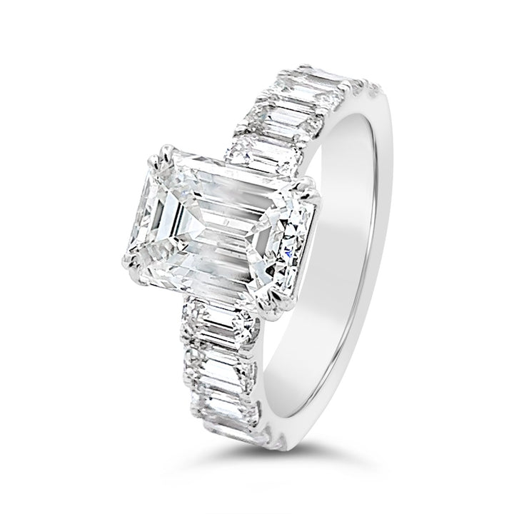 Modern Diamond Engagement Ring with Emerald side stones