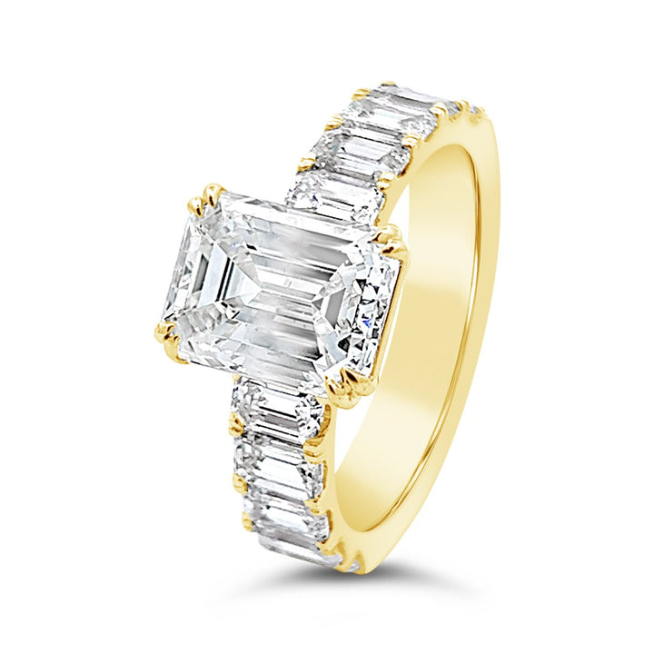 Modern Diamond Engagement Ring with Emerald side stones